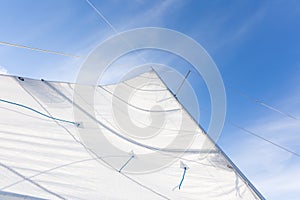 Close up of yacht sail on sky background