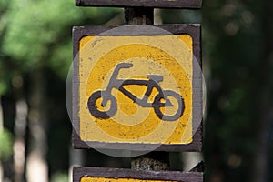 Close up yellow and brown bike on Wood banner sign