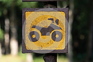 Close up yellow and brown motorcycle on Wood banner sign