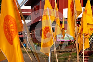 Close up of yellow Buddhist flags (The Dharmacakra flag)