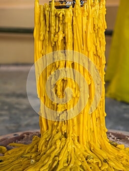 Close up yellow candle drippings