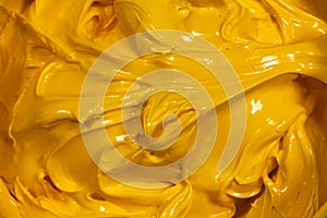 close up yellow color of oil paint.