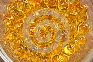 A close-up of yellow cosmetics pearl for bodycare