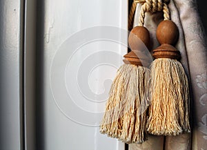 Close-up of yellow curtain bobbins