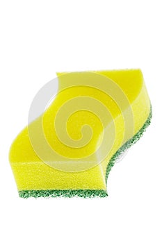 Close up of yellow dish scrubbing pad isolated white background