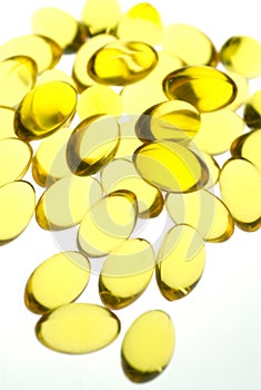 Close up of yellow gel capsules.