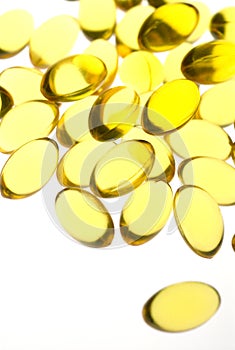 Close up of yellow gel capsules.