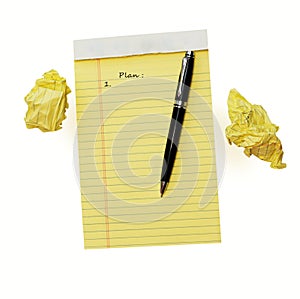 Close up of yellow note pad isolated on white background