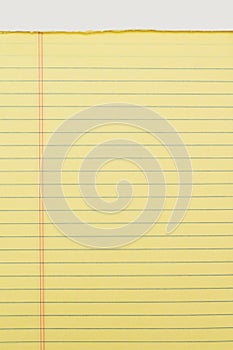 Close up of yellow note pad isolated on white background