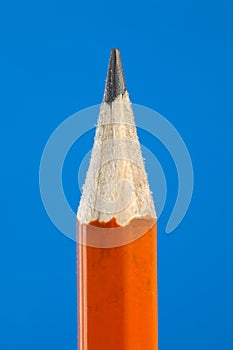 Close up of yellow pencil tip on blue background