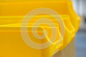 Close up of yellow plastic parts bins