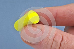 Close up of yellow polymer foam hearing protectors