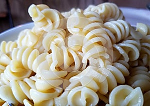 Close up of yellow Rotini pasta on a plate