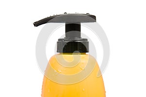 Close up of yellow shampoo bottle