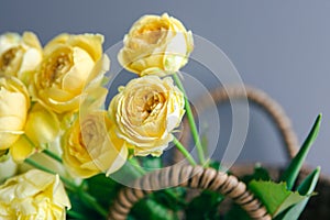 Close-up of yellow spring flowers in a basket.