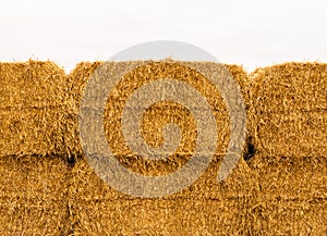 Close-up of yellow stacked hay bales