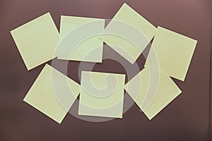 Close-up of yellow sticky stickers on a dark background. yellow paper cards mock up with copy space