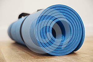 Close-up of yoga mat on a wooden surface