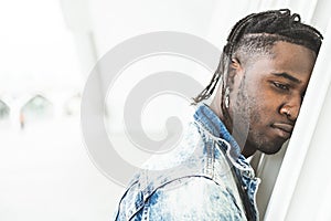 Close-up young african american man attractive casual and modern dress on city street. Black man