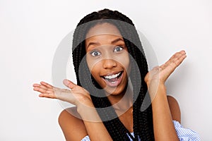 Close up young african woman looking surprised on white background