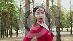 Close up of young asian woman are dancing Traditional Spanish dance in summer forest