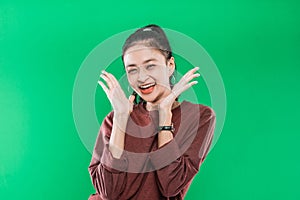 close up young Asian woman expressing wide-open mouth and raising hands in amazement