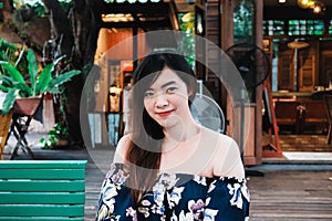 Close up of young Asian woman in the restaurant.