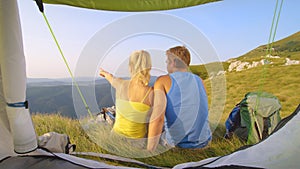 CLOSE UP: Young blonde haired girl showing her boyfriend the scenic landscape.