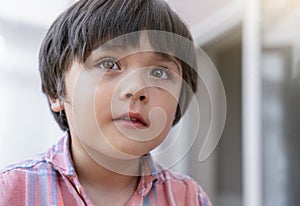 Close up  young boy crying, Head shot of Kid with sad face, Emotional portrait of lonely child with unhappy face, Bored 5 years