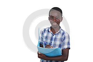 close up of young boy taking note in notebook in hand, smiling