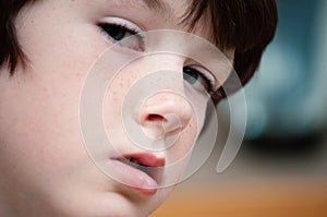 Close up of a young boy to show his blue eyes