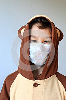 Close up of Young boy wearing mask