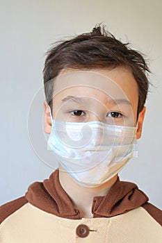 Close up of Young boy wearing mask