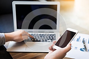 Close up of young business man using mobile smart phone for work