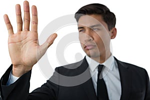 Close up of young businessman touching invisible interface