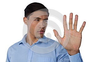 Close up of young businessman using invisible screen