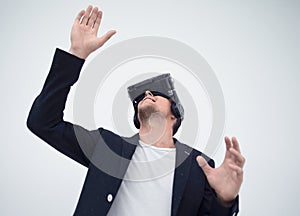 Close up.young businessman in a virtual reality helmet.