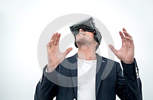 Close up.young businessman in a virtual reality helmet.