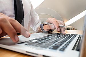 Close-up Of Young businesswomen working on laptop for online searching