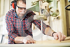 Close up of a young carpenter at work