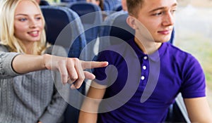 Close up of young couple driving in travel bus