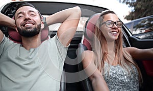 Close up.young couple travelling by car