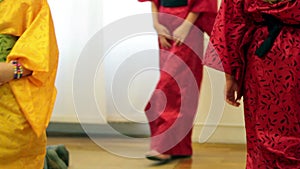 Close up of young girls dressed as japanese old fashioned clothes