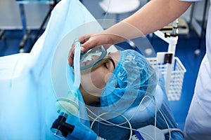 Close up of young lady getting narcosis before the surgery