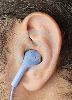 Close up young man ear earphone