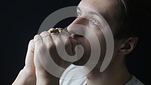 Close up of young man praying to God. Concept of faith and religion