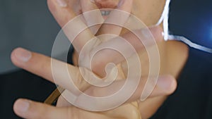 Close up of Young man praying to God. Concept of faith and religion