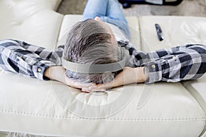 Close up of young man relaxing with headphones