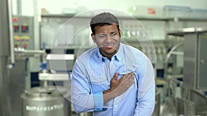 Close up young man suffering from chest pain.