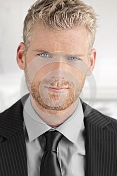 Close-up of young man in suit